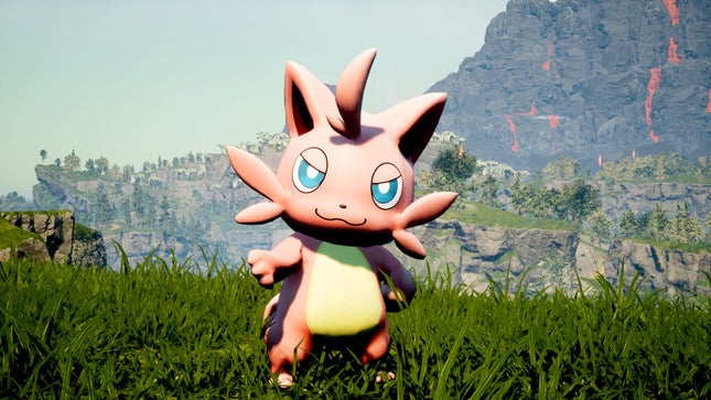 A Palworld companion stands on the grass, with mountains behind him, with his right arm extended.